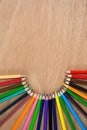 Colored pencils arranged in semi circle Royalty Free Stock Photo