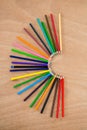Colored pencils arranged in semi circle Royalty Free Stock Photo