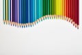 Colored pencils arranged in a wave shape Royalty Free Stock Photo