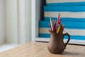 Colored pencils in a beautiful jug Royalty Free Stock Photo