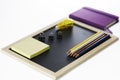 Colored pencils, black board, notebook and memopad Royalty Free Stock Photo