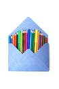 Colored Pencils in blue envelope Isolated on White Background Copy Space School Suplies Royalty Free Stock Photo