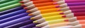 Colored pencils closeup. Collection of colored pencils in row