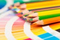 Colored pencils and color chart of all colors Royalty Free Stock Photo