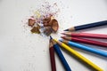 Colored pencils with colorful pencil shavings Royalty Free Stock Photo