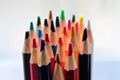 Colored pencils crayons close up sharpened rainbow many choice Royalty Free Stock Photo