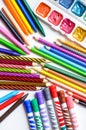 Colored pencils, crayons, markers and paints on white background Royalty Free Stock Photo