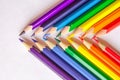 Colored pencils crossed on white background Royalty Free Stock Photo