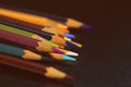 Colored pencils on a dark background. Retro style Royalty Free Stock Photo