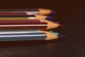 Colored pencils on a dark background. Retro style Royalty Free Stock Photo