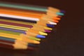 Colored pencils on a dark background. Retro style Royalty Free Stock Photo