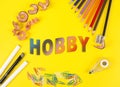 Colored pencils of different colors and a pencil sharpener and pencil shavings on the yellow background. Word Hobby Royalty Free Stock Photo