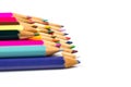 Colored pencils for drawing and learning at school lie on a white background Royalty Free Stock Photo