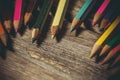 Colored pencils for drawing on a wooden background Royalty Free Stock Photo