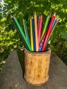 Colored pencils for drawing in a wooden glass Royalty Free Stock Photo