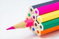 Colored pencils, ends are not sharpened, pink pencil sharpened, on white background, selective focus Royalty Free Stock Photo