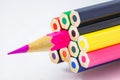 Colored pencils, ends are not sharpened, pink pencil sharpened, on white background, selective focus Royalty Free Stock Photo