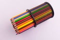 Colored pencils in a glass on a white background. View from the top. Royalty Free Stock Photo