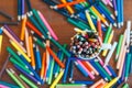 Colored pencils in a glass on wooden background Royalty Free Stock Photo
