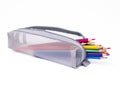 Colored pencils in a gray pencil case on a white background Royalty Free Stock Photo