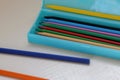 Colored pencils in a light blue pencil case Royalty Free Stock Photo