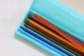 Colored pencils in a light blue pencil case Royalty Free Stock Photo