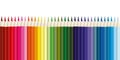 Colored pencils, lots of colors, the view from above. Pencils are arranged exactly in a row. Concept of creativity and education Royalty Free Stock Photo