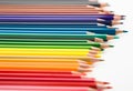 Colored pencils lying in irregular row Royalty Free Stock Photo
