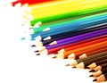 Colored pencils lying in irregular row Royalty Free Stock Photo