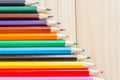 Colored pencils on wooden planks Royalty Free Stock Photo