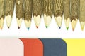Colored pencils made from branches of trees and colored books isolate on white background Royalty Free Stock Photo