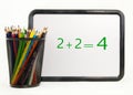 Colored Pencils With Math Dry Erase Board Royalty Free Stock Photo