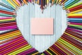 Colored pencils and note paper Royalty Free Stock Photo