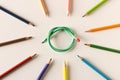 Colored pencils with one flexible pencil on white background. The concept of flexibility in decision-making