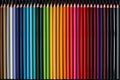 Colored pencils palette. School supplies for kids. Colorful wooden pencils lined up Royalty Free Stock Photo