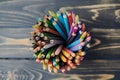 High angle view on colored pencils against wooden surface