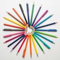 Each pencil and pen radiates outward, with the tips forming a small inner circle Royalty Free Stock Photo
