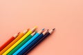 Colored pencils on pink paper Royalty Free Stock Photo