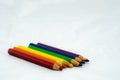 Rainbow Colored Pencils on white background Royalty Free Stock Photo