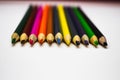 Colored pencils row on white background Royalty Free Stock Photo