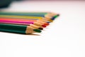Colored pencils row on white background Royalty Free Stock Photo
