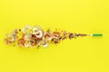 Colored pencils with shavings on a yellow background Royalty Free Stock Photo