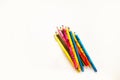 Colored pencils are on the school notebook. Notebook lies on the Desk at school. the kids are learning. Royalty Free Stock Photo