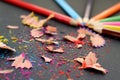 Colored pencils sharp sharpened lie on a table with rubbish Royalty Free Stock Photo