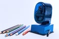 Colored pencils and sharpener Royalty Free Stock Photo