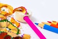 Colored pencils, sharpener and shavings Royalty Free Stock Photo