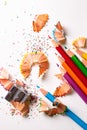 Colored pencils with shavings and a pencil sharpener Royalty Free Stock Photo