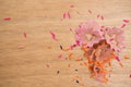 Colored pencils shavings on a wooden background Royalty Free Stock Photo