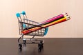 Colored pencils in a shopping trolley. Art set. Fine art Royalty Free Stock Photo