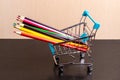 Colored pencils in a shopping trolley. Art set. Fine art Royalty Free Stock Photo